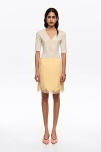 Falda mini encaje amarilla